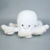 pack-de-2-peluches-pieuvre-reversible-bleu-et-rose-jouet-doux-et-tendre-5a-2 Une peluche blanche en forme de pieuvre souriante avec des yeux noirs.