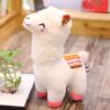 Peluche de lama blanche avec un motif arc-en-ciel sur le dos.
