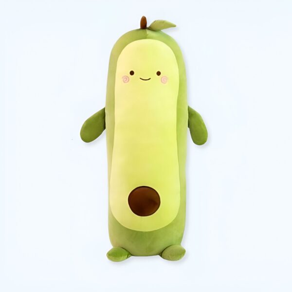 Peluche avocat souriant avec un noyau brun, parfait pour la décoration ou comme coussin.