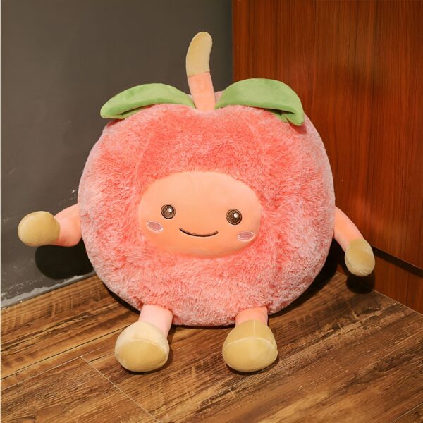 Peluche en forme de pêche souriante avec des petites jambes et des bras.