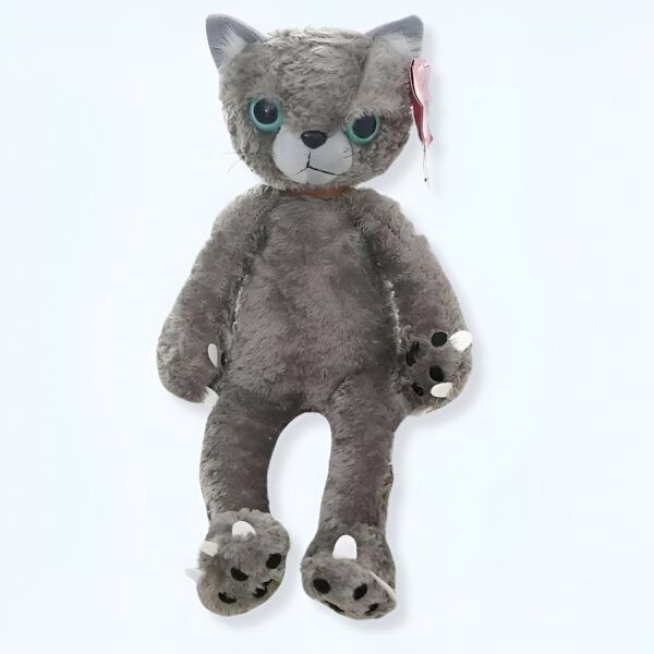 Peluche de chat gris avec de grands yeux bleus et des griffes blanches.