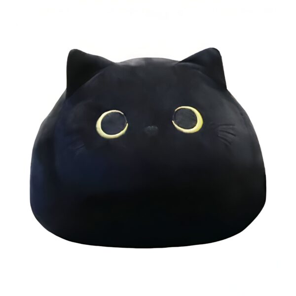 Un coussin en forme de chat noir avec de grands yeux jaunes.
