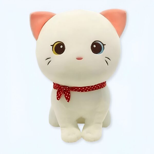 peluche-chaton-blanc-jouet-doux-pour-enfants-compagnon-calin-1a-2 Une peluche de chat blanc avec des yeux marrons et bleus, portant un ruban rouge à pois blancs.