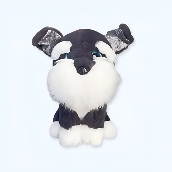 Peluche de chien noir et blanc avec de grands yeux bleus.