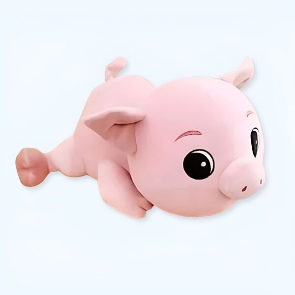 Une peluche rose en forme de cochon avec de grands yeux noirs et un museau rose.