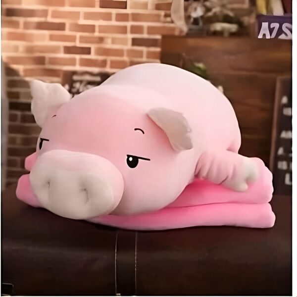 peluche-cochon-rose-assoupi-cadeau-enfant-2a Gros coussin en forme de cochon rose allongé sur un canapé.