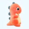 Peluche dinosaure rose avec des yeux noirs et des piques bleues sur le dos.