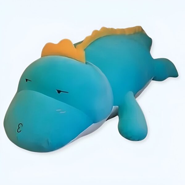 Peluche de dinosaure bleu avec des yeux noirs et une crête orange.