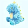 Doudou dinosaure bleu en peluche avec des yeux fermés, une lumière jaune et un bouton de musique. Parfait pour les enfants.