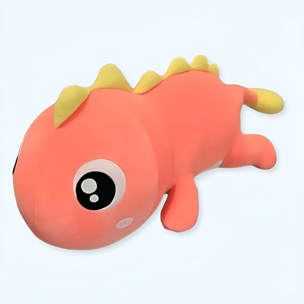 Peluche de dinosaure rose avec des yeux noirs et une crête jaune.