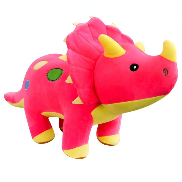 Un dinosaure en peluche rose avec des détails jaunes et des yeux noirs.