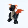 Un dragon en peluche noir avec des ailes orange.