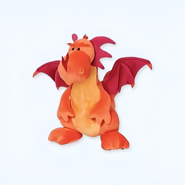 Peluche de dragon orange avec des ailes roses, debout sur un fond blanc.