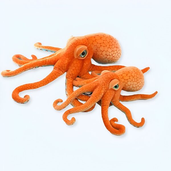 Deux poulpes en peluche orange, un grand et un petit, sur un fond blanc.