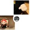 Une peluche de Ron Weasley avec un sac à main Harry Potter.