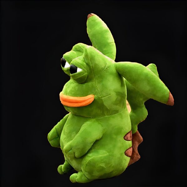 Une peluche verte en forme de grenouille avec une bouche orange et une expression triste.
