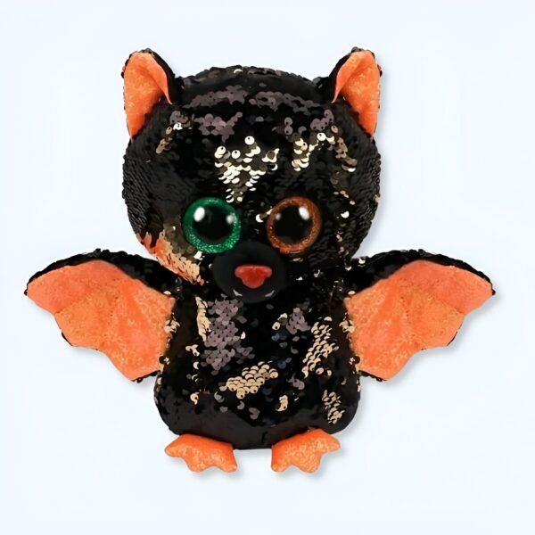 Une chauve-souris en peluche noire et orange avec des paillettes et de grands yeux.