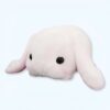 Une peluche rose en forme de lapin avec de grands yeux noirs.