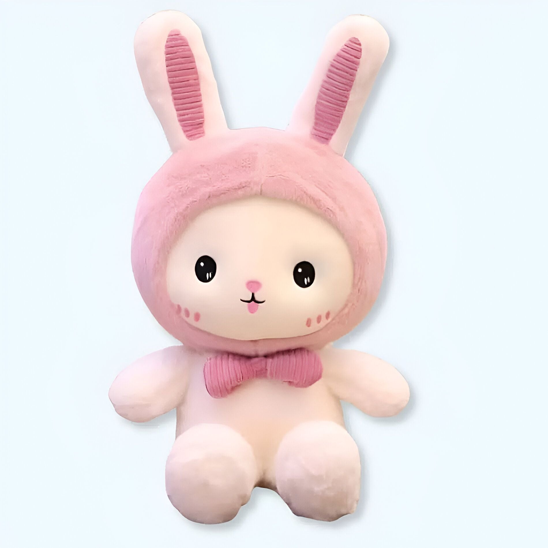 Coniglietto di peluche con cappellino rosa, morbidezza e coccole garantite.