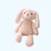 peluche-lapin-rose-doudou-tout-doux-pour-bebe-1a-4 Une peluche rose en forme de lapin avec de longues oreilles blanches.