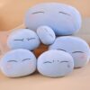Ensemble de cinq coussins en forme de blob avec des expressions faciales différentes. Les coussins sont bleus et moelleux, parfaits pour se détendre et décorer une chambre.