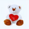 Un ours en peluche blanc tenant un cœur rouge avec l'inscription "I Love You".
