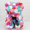 Ours en peluche fait de roses artificielles multicolores avec un ruban noir portant l'inscription "Just for you".