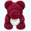 Ourson en rose rouge tenant un cœur blanc. Cadeau romantique parfait pour la Saint-Valentin.