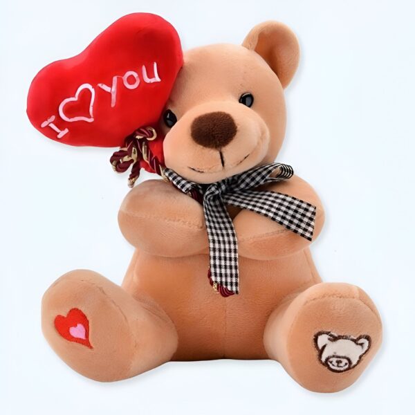Ours en peluche brun tenant un cœur rouge avec l'inscription "I love you". Il porte un ruban à carreaux noirs et blancs.