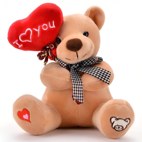 Un ours en peluche brun tenant un cœur rouge avec l'inscription "I love you". L'ours est assis sur un fond blanc.