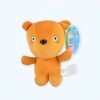 Ours en peluche brun avec un sourire, portant une étiquette bleue avec un code-barres.