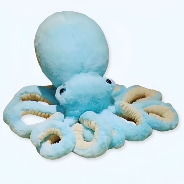 Grande pieuvre en peluche bleu clair avec des yeux noirs et des tentacules beiges.