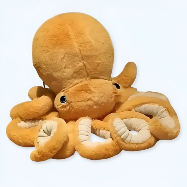 peluche-pieuvre-jaune-jouet-enfant-cadeau-original-mignon-1a-2 Une peluche de pieuvre en fourrure brune avec des yeux bleus.