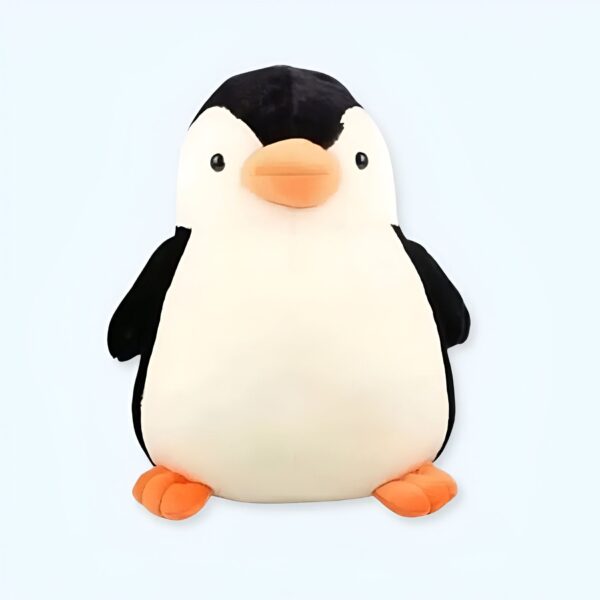 Une peluche de pingouin en peluche avec un corps blanc et une tête et des ailes noires.
