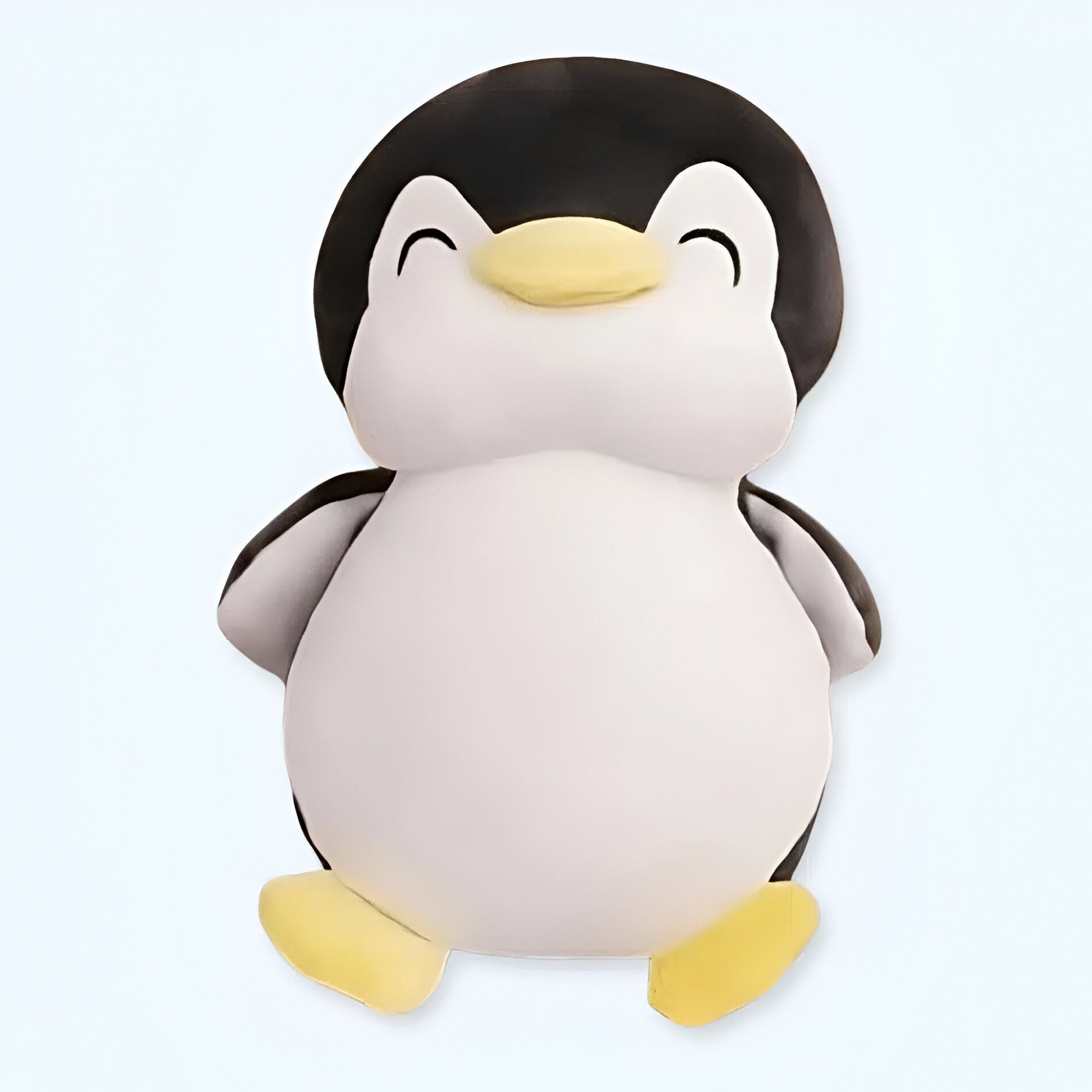 Peluche de pingüino negro sonriente: suavidad y diversión.