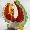 Peluche de l'oiseau légendaire Ho-Oh du jeu vidéo Pokemon, avec des plumes rouges, blanches et vertes.