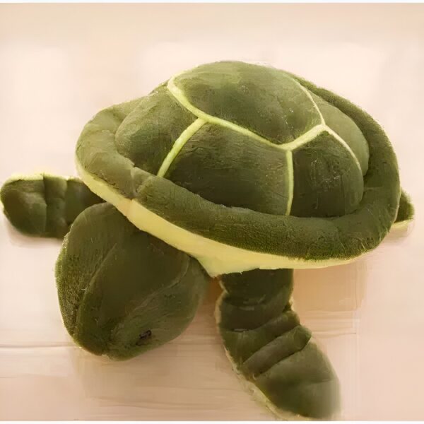 Une tortue en peluche verte avec une coquille en forme de dôme et des pattes.