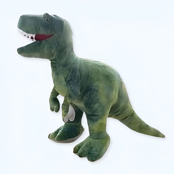 Un dinosaure en peluche vert avec une grande bouche ouverte et des dents blanches.