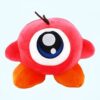 Peluche de l'oeil de l'ennemi de Kirby, une créature rouge avec un seul oeil bleu et blanc, de petits bras oranges et un seul antenne noire.
