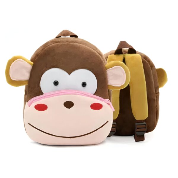 Sac à dos en peluche en forme de singe avec des yeux noirs, un nez rose et une fermeture éclair rose. Le sac à dos est marron avec des bretelles jaunes.