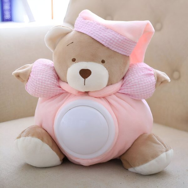 Ours en peluche rose avec une lumière intégrée, idéal pour apaiser les bébés et les enfants. Il est parfait pour la décoration d'une chambre d'enfant.